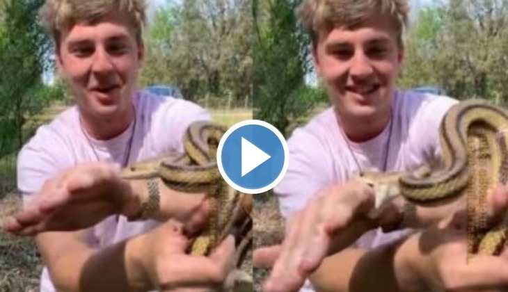 Snake Viral Video: खतरनाक सांप के मुंह में शख्स ने दे दिया अपना हाथ, वीडियो देख रह जाएंगे हक्के-बक्के